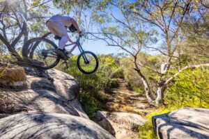 Mountain biker riding at Oxford Falls, Sydney – 210124_5004