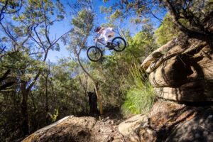 Mountain biker riding at Oxford Falls, Sydney – 210124_5009