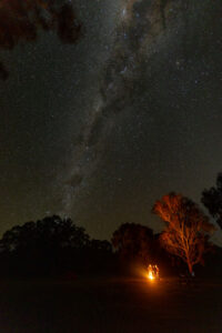 A campfire under the Warrumbungle sky
