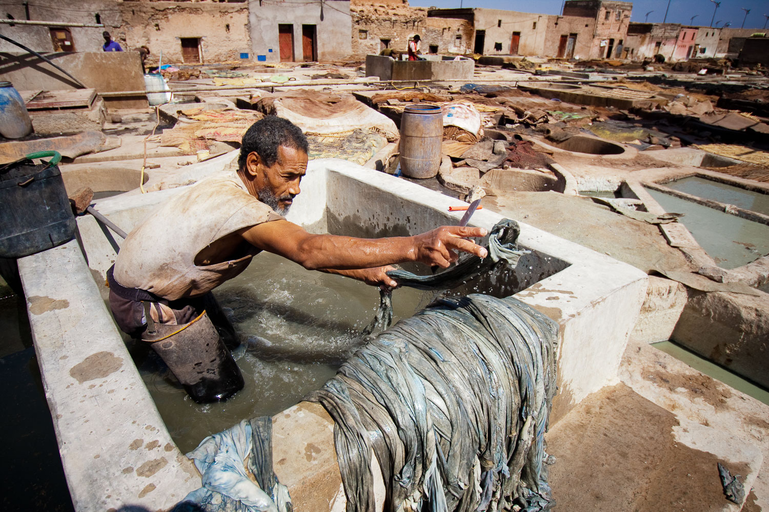 A tannery worker treating the leather in one of Marrakesh's tanneries.