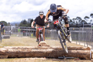 Rider jumping a log obstacle on the course at Sea Otter Australia