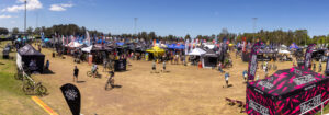 Wide view of the Sea Otter expo field with tents and crowds